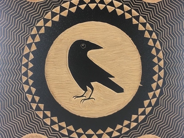 A crow encircled by patterns